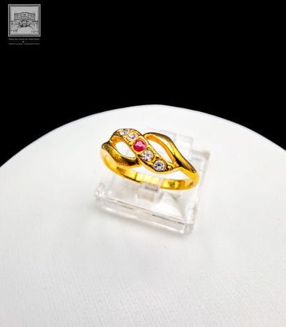 Ring
14K yellow gold 
Set with a small ruby...