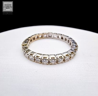 Bague alliance américaine
en or gris 18K...