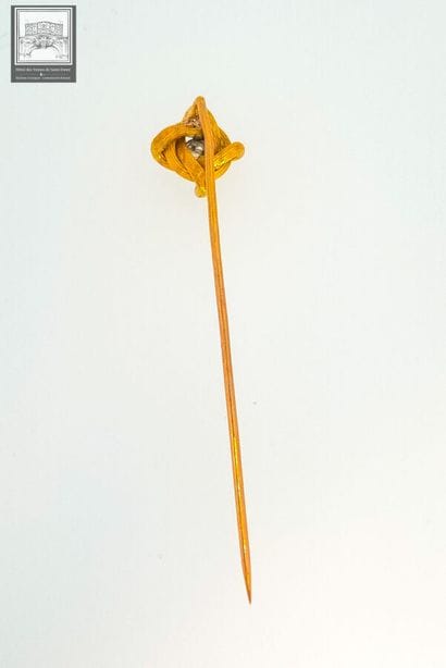 Epingle à cravate en or jaune 18K 750/°°°
Poinçon...