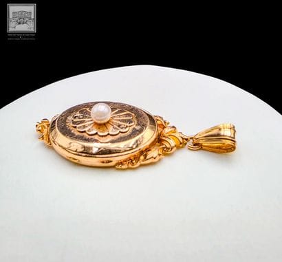 Pendentif porte photo, en or jaune 18K 750°°°
Poinçon...