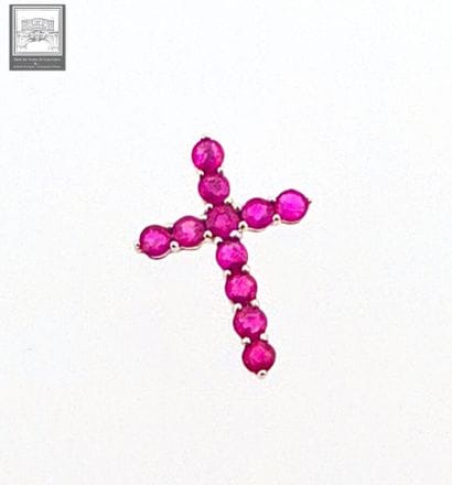 Croix en or blanc 750°/.(18K) 0g60 ornée...