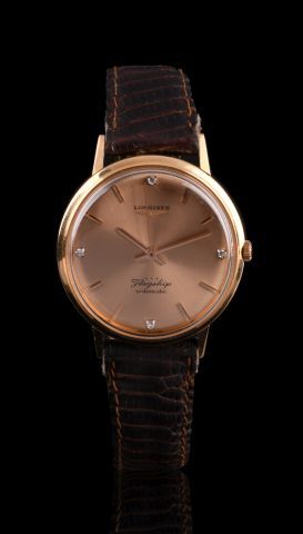 LONGINES

Montre de ville en or rose 18K...