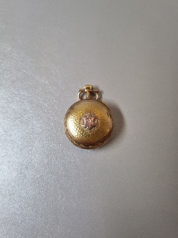 Neck watch in 18k yellow gold (horse head...