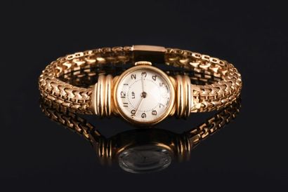LIP

Montre de ville en or jaune 18K 750...