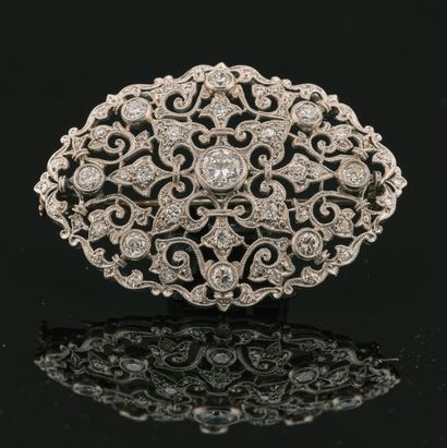 Broche en or gris 18K 750 millièmes et platine...