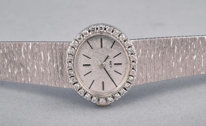 REY 
Montre de dame en or gris 18k 750 millièmes....