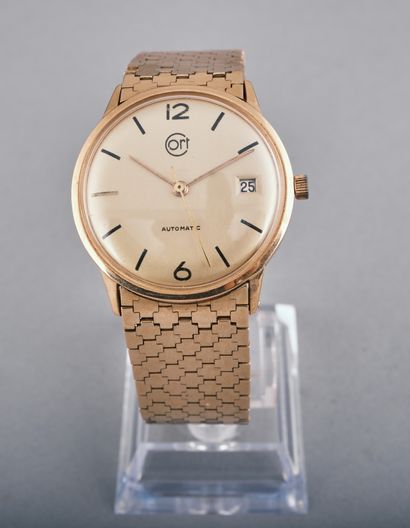 CORT 
Montre mixte en or jaune 18k 750 millièmes.
Boitier...