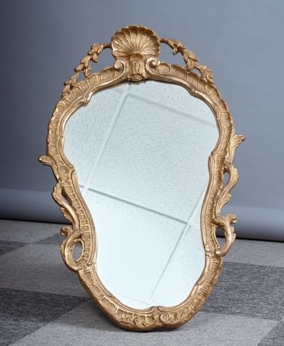 Rococo style mirror in wood and gilded stucco...