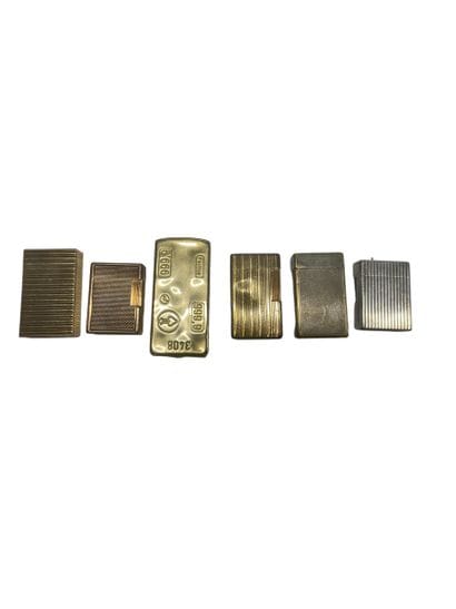 DUPONT
Lot comprising five gilded metal lighters....