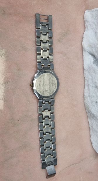 TISSOT
Mixed steel and gold-plated watch.
Oval...