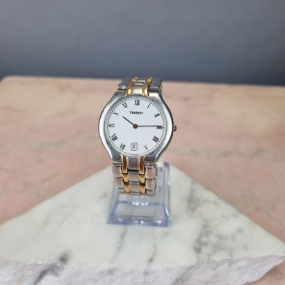TISSOT
Mixed steel and gold-plated watch.
Oval...
