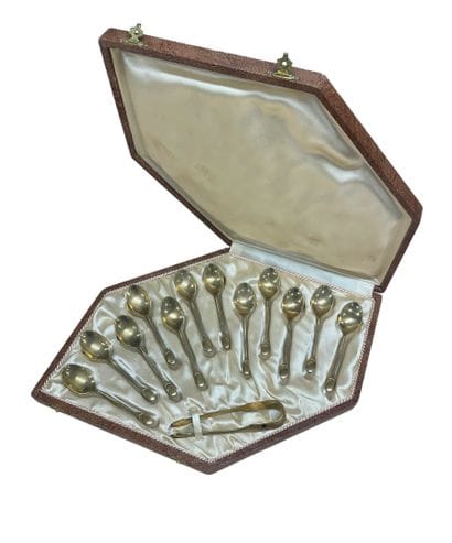 Set of 12 gilded metal moka spoons and sugar...