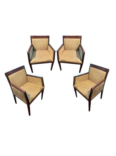 Suite de quatre fauteuils en bois noirci,...