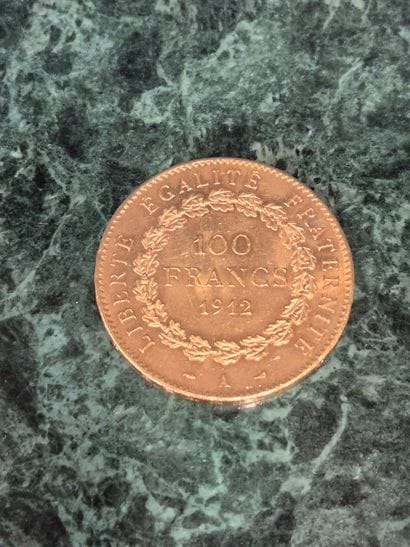 Pièce de 100 francs en or 1912, Génie gravant...
