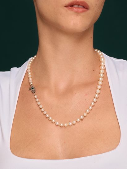 Necklace of tumbling cultured pearls ranging...