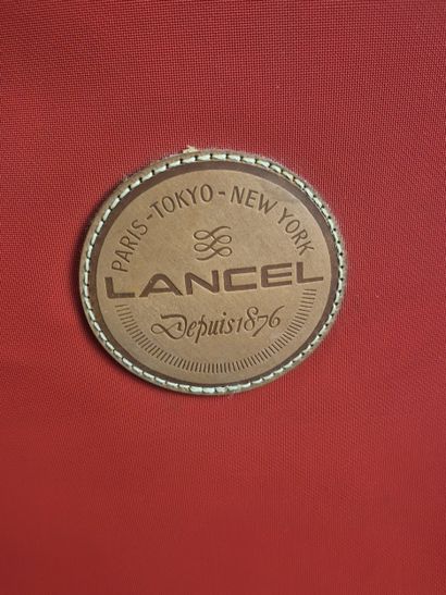 LANCEL - Housse porte-habits en toile rouge...