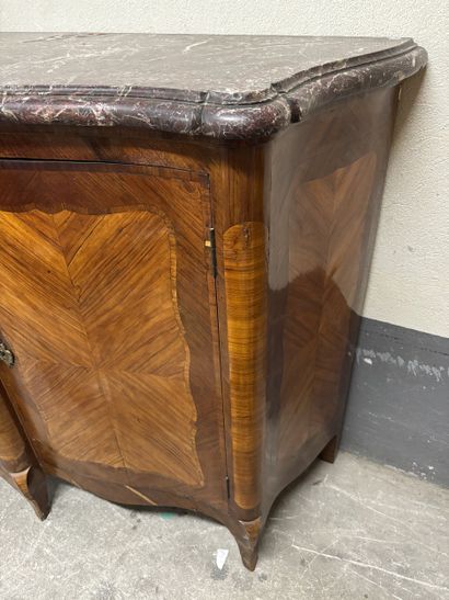 A large enfilade in veneered wood and frieze...