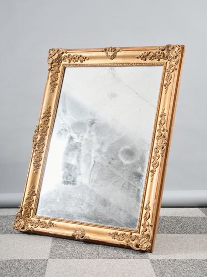 Large rectangular mirror in carved and gilded...