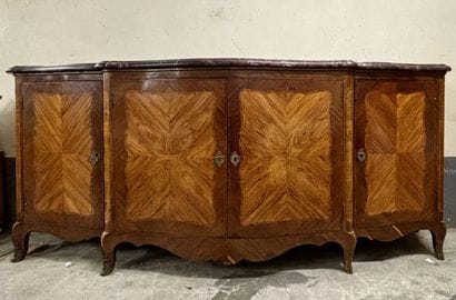 A large enfilade in veneered wood and frieze...