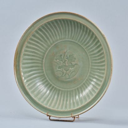 CHINA, Ming period
A celadon dish of circular...