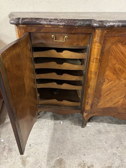 A large enfilade in veneered wood and frieze...