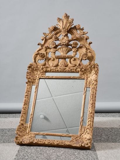 Wood and gilded stucco mirror with flower...
