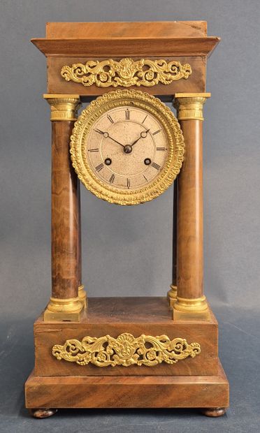 Portico clock in veneered wood resting on...