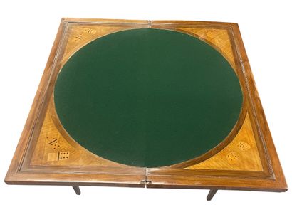 A rectangular wood veneer game table decorated...