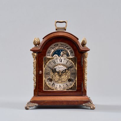 Veneered wood clock. The dial is topped with...