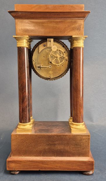 Portico clock in veneered wood resting on...