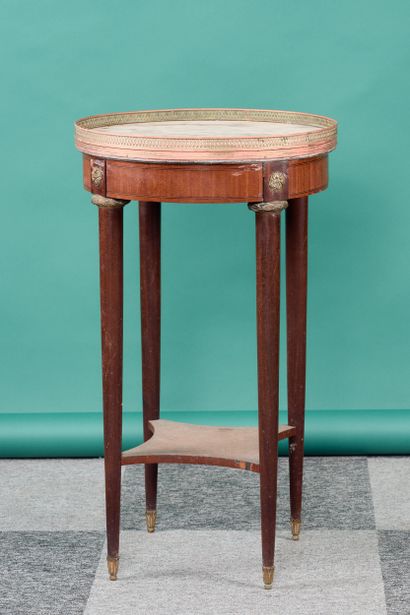 Circular side table in veneered wood, resting...