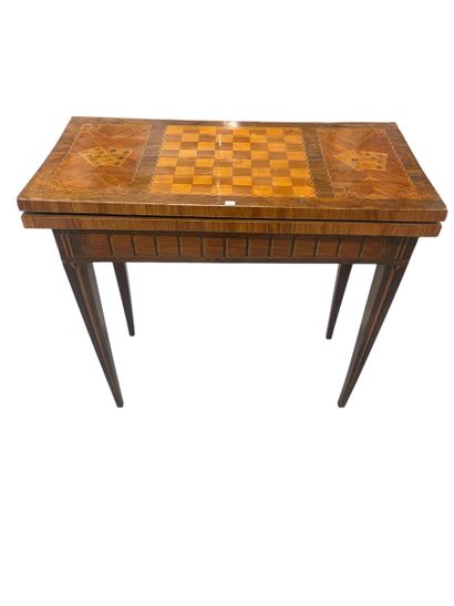 A rectangular wood veneer game table decorated...