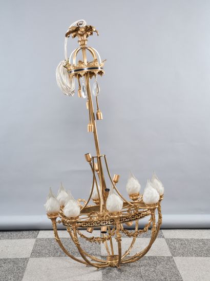 A large bronze chandelier with a gilded patina,...