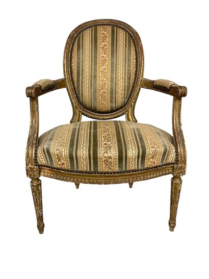 Gilded carved wood cabriolet armchair with...