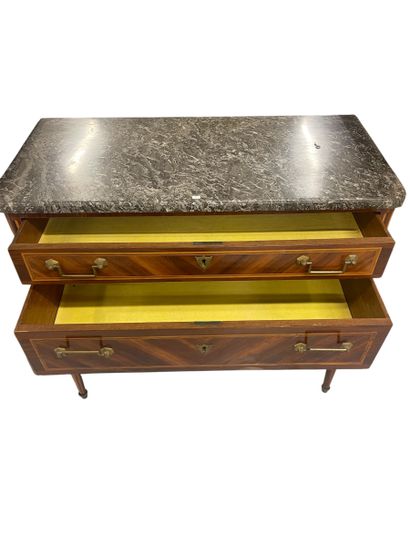 Veneered chest of drawers opening with three...