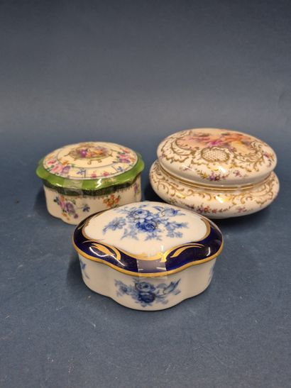Set of three enameled porcelain covered boxes:...