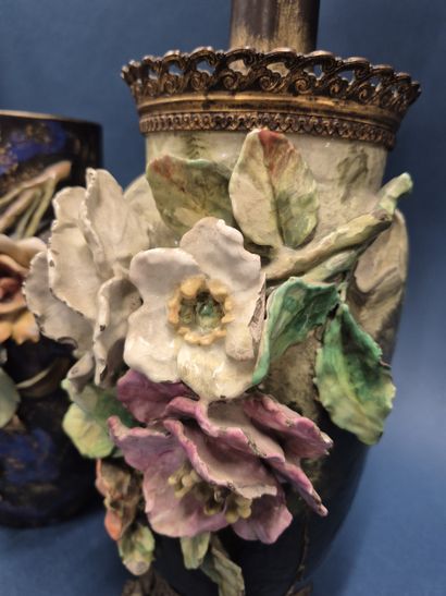 Reunion of two barbotine vases with flowers...
