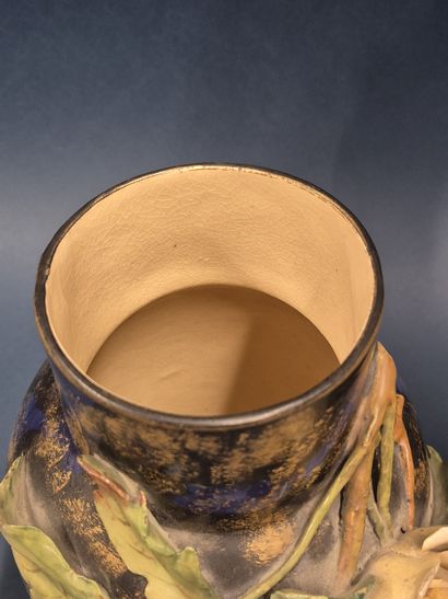 Reunion of two barbotine vases with flowers...