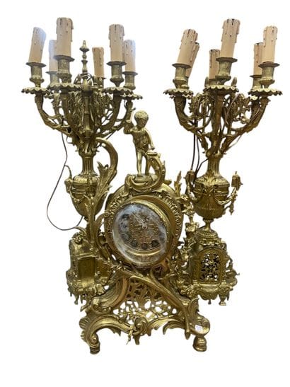 Gilt bronze mantel set including a rocaille...