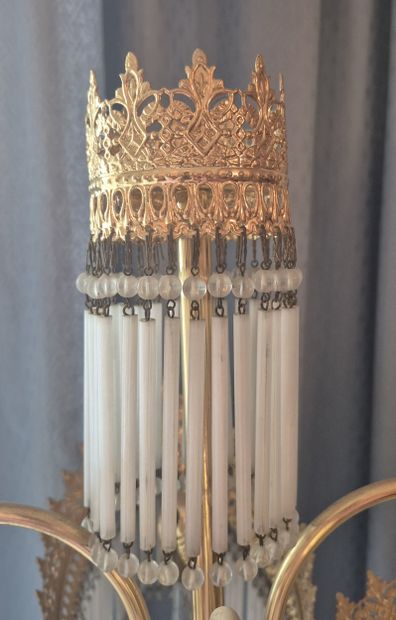 Gilded metal lamp with four arms terminating...