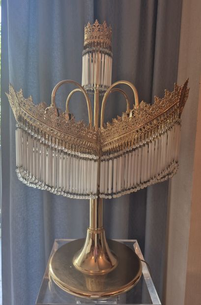 Gilded metal lamp with four arms terminating...