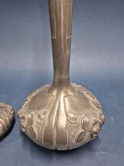 Two pewter soliflor vases decorated with...