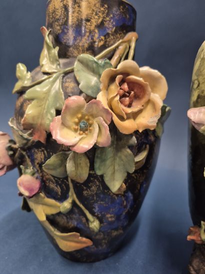 Reunion of two barbotine vases with flowers...