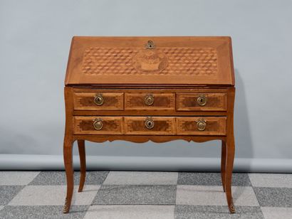 A veneered desk decorated with a cube marquetry...