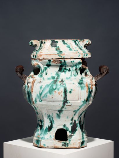 Small earthenware stove with green marbled...