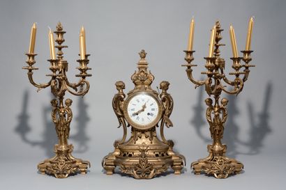 Chased and gilded bronze mantel set decorated...