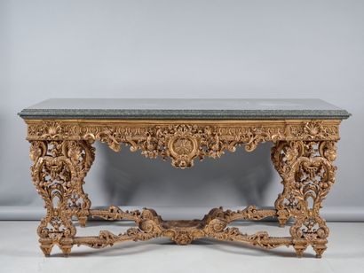 A richly carved and gilded wooden sconce...