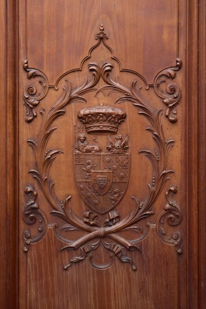 Carved wood armoire opening with two large...