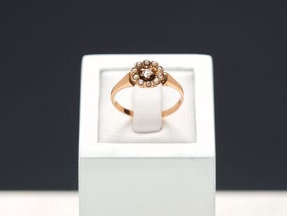 Bague en or rose 18k 750 millièmes centrée...