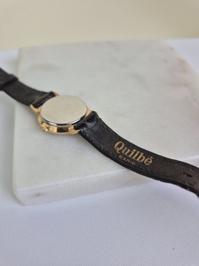 QUILBE 
Montre bracelet de dame en plaqué...